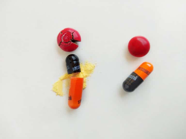 red yellow and black medicine capsules